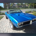 Lost Your Car in a Dream Last Night? This Is Deeper Than “Losing Direction” Mike's blue 1968 Pontiac Firebird convertible in a softly blurred landscape frame.